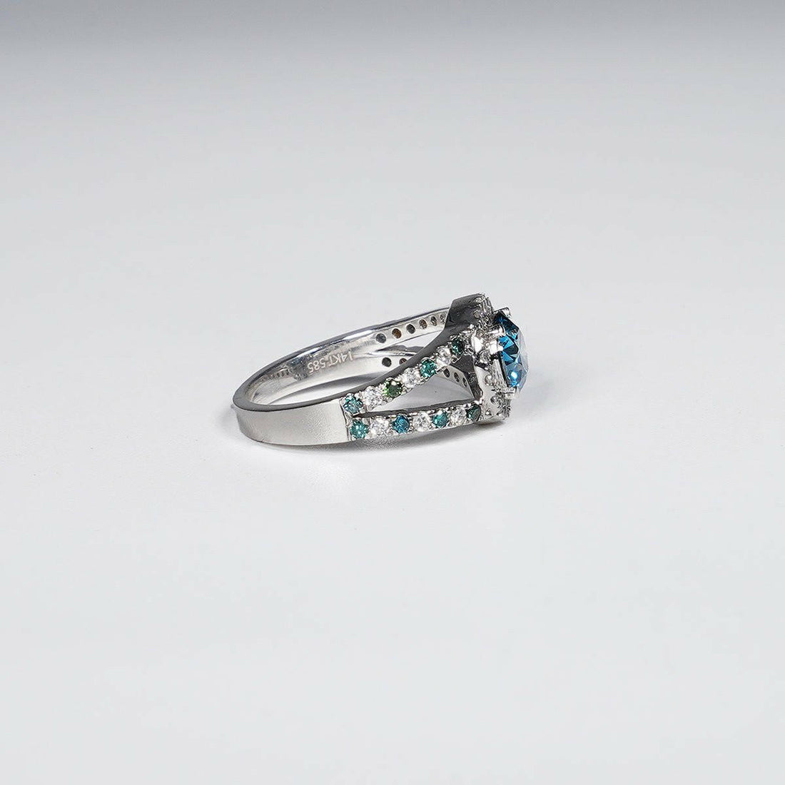 1.46 Carat Vivid Blue Round Cut Lab Grown Diamond Ring in 14K White Gold.