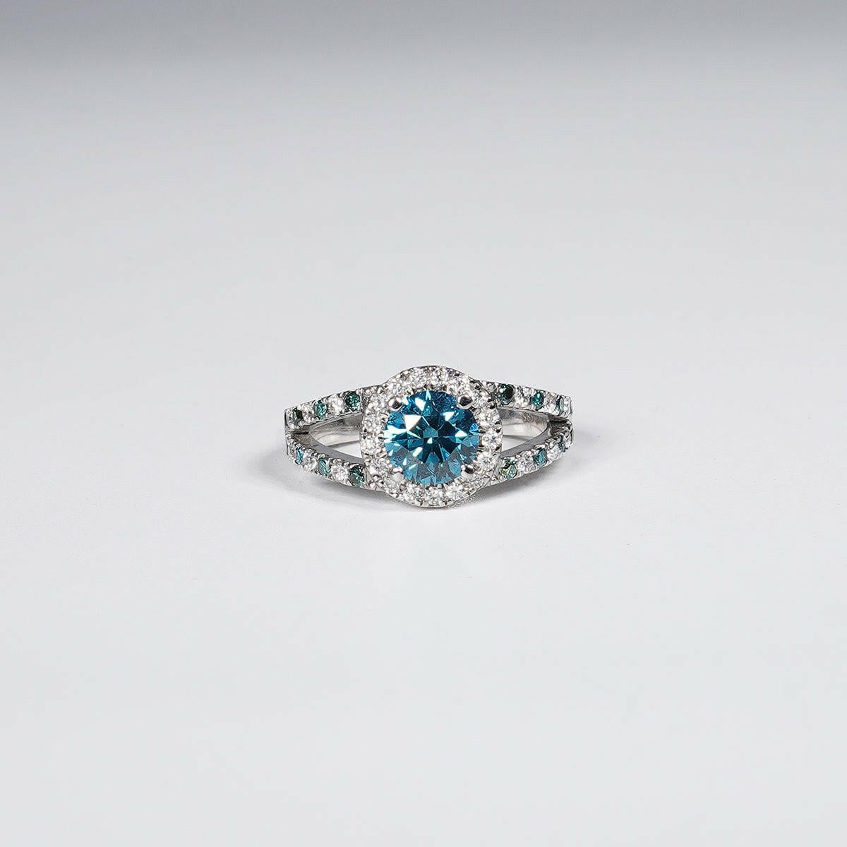 1.46 Carat Vivid Blue Round Cut Lab Grown Diamond Ring in 14K White Gold.
