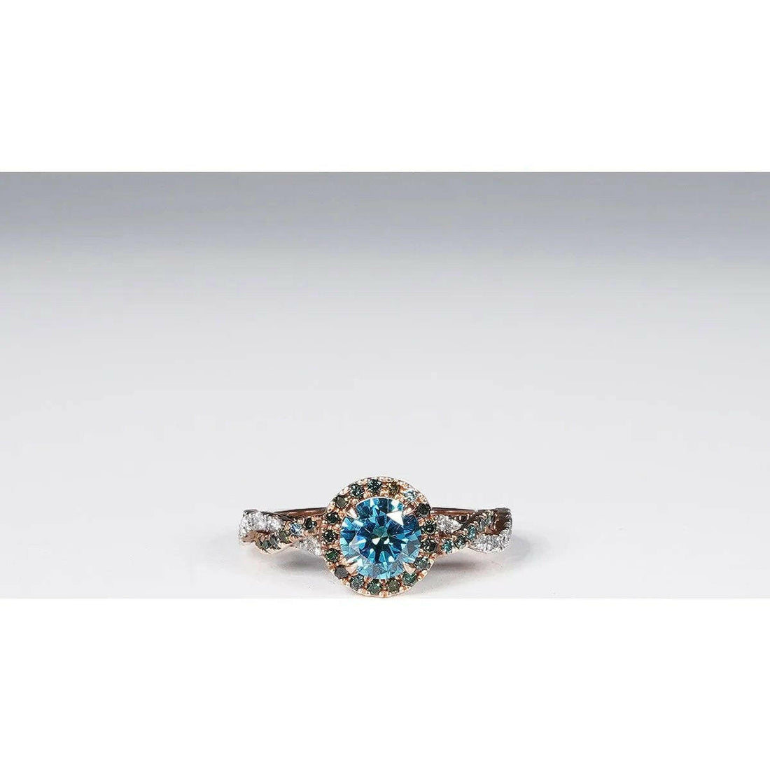 1.79 Carat Vivid Blue Round Cut Lab Grown Diamond Ring in 14K Rose Gold.