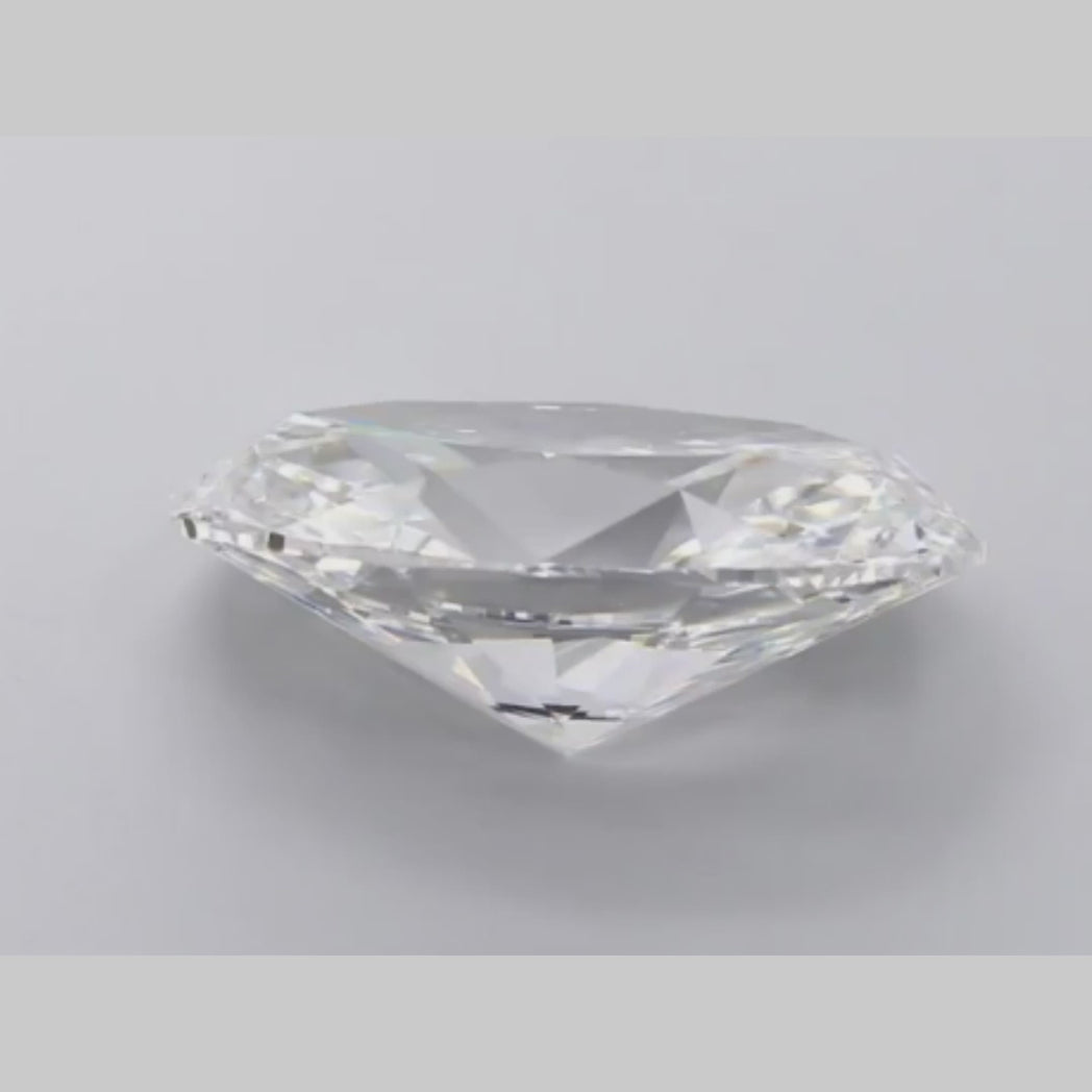 Embodying 7.69ct Lab Grown Oval Cut Diamond Elegance.